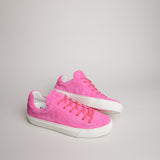 Angled pair of women’s fuchsia suede Milano sneakers