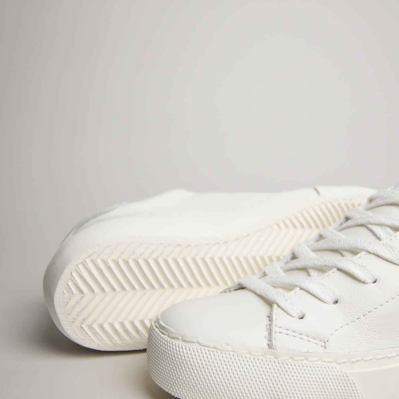 Close-up of white goat leather, toe stitching and outsole on the women’s Milano