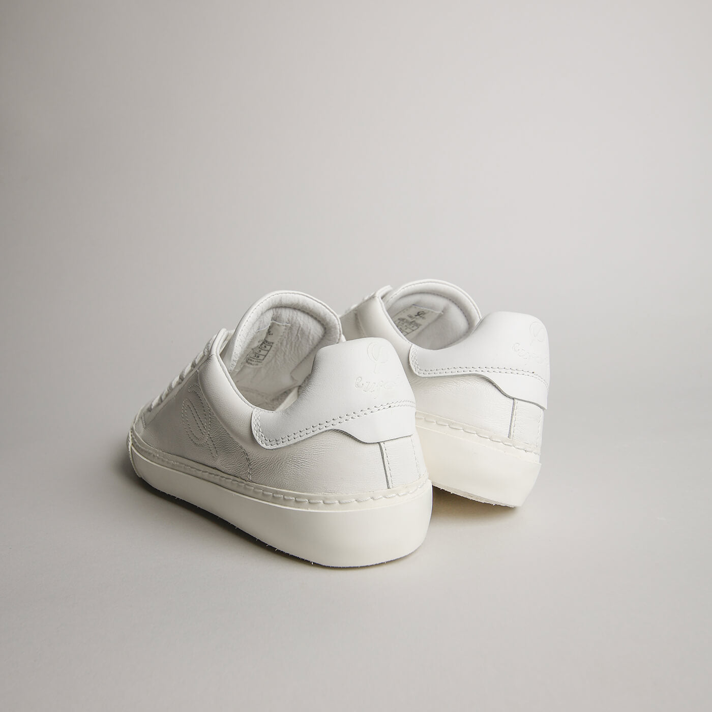 Rear view of women’s white goat leather Milano sneakers
