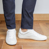 Men wearing white goat leather Milano sneakers, front and side view