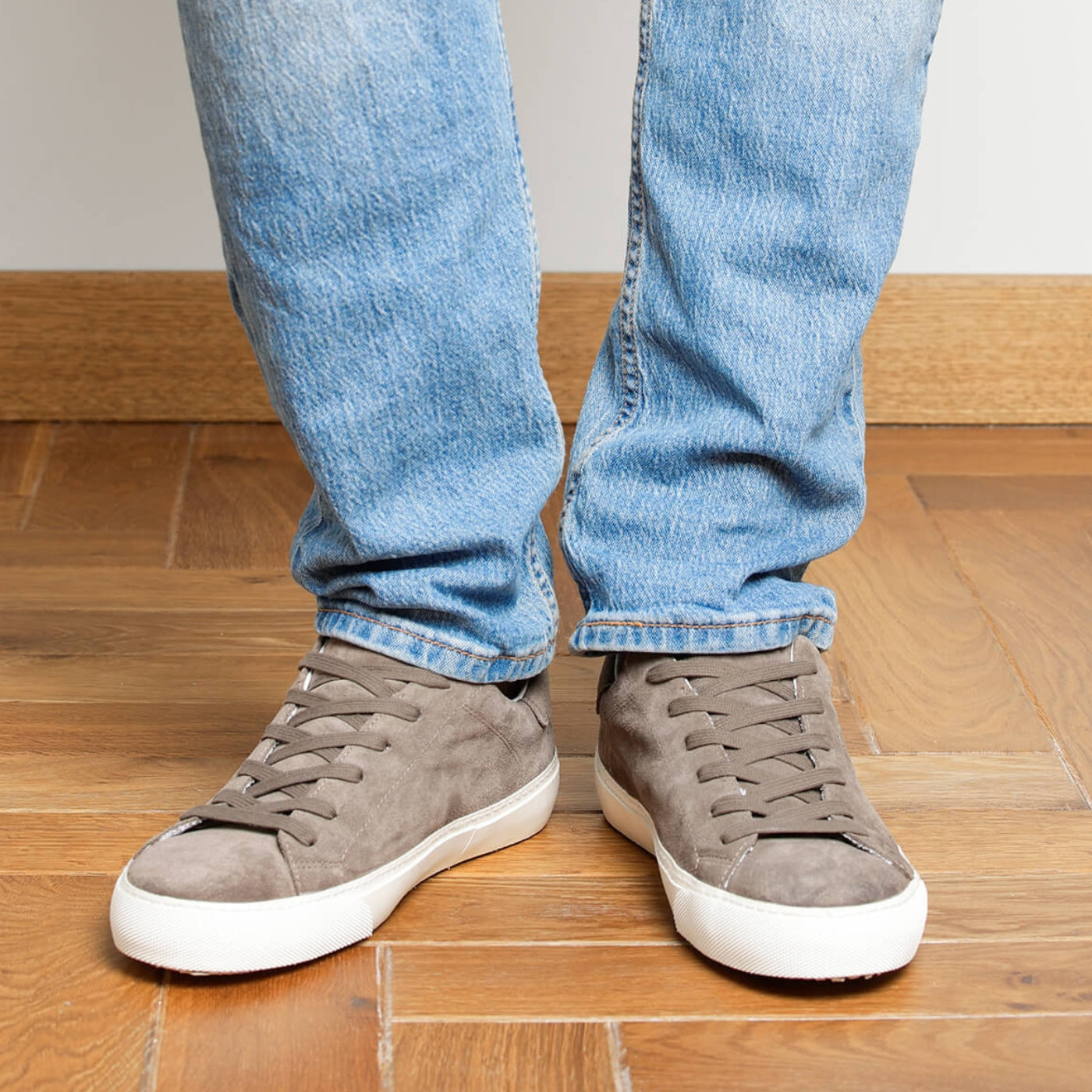 Man wearing dark taupe suede Milano sneakers, front view
